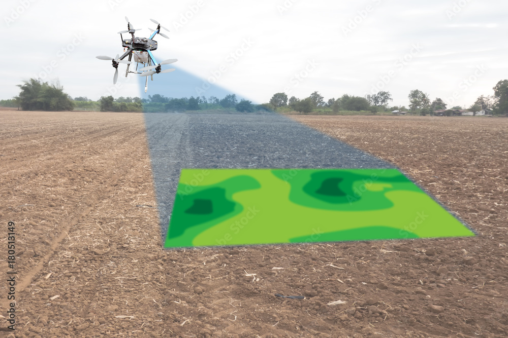 drone for agriculture, drone use for various fields like research analysis,  safety,rescue, terrain scanning technology, monitoring soil hydration  ,yield problem and send data to smart farmer on tablet foto de Stock
