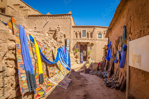 Narrow streets of Kasbah Ait Ben Haddou with traditional moroccan souvenirs, Morocco photo