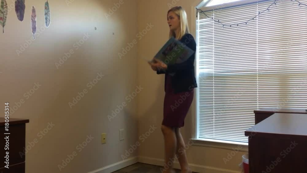 Young female University student practicing class presentation. Young female University student practicing class presentation.