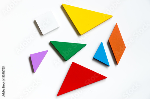 Straggled tangram puzzle wait to complete the shape on white background Free Download Straggled tangram puzzle wait to complete the shape on white background - GFXLoad