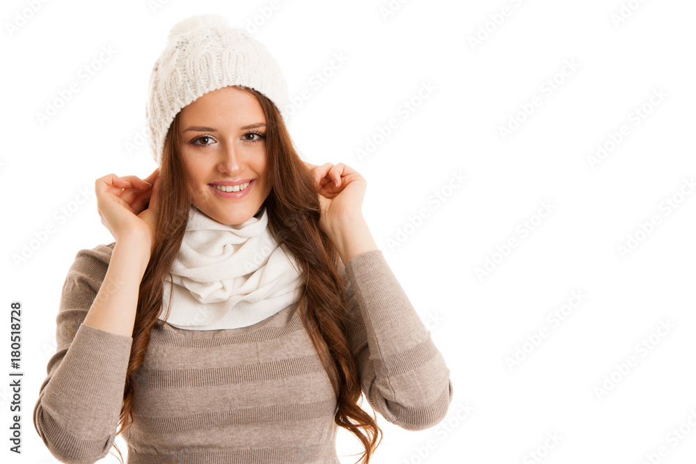 Beautiful young woman in sweater, hat and scarf gestures cold temperatures Beautiful young woman in sweater, hat and scarf gestures cold temperatures