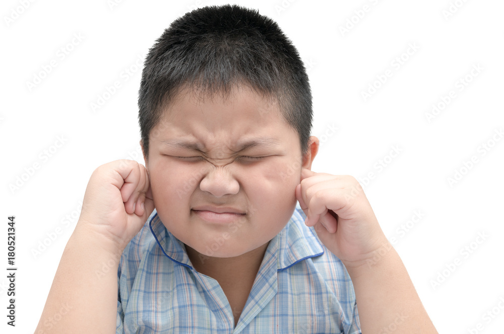 boy closes ears with fingers to protect from loud noise boy closes ears with fingers to protect from loud noise