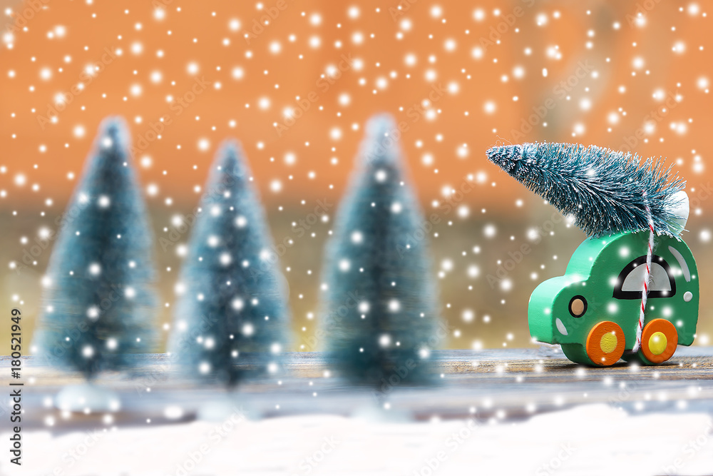Wooden car carrying a christmas tree. Wooden car carrying a christmas tree.