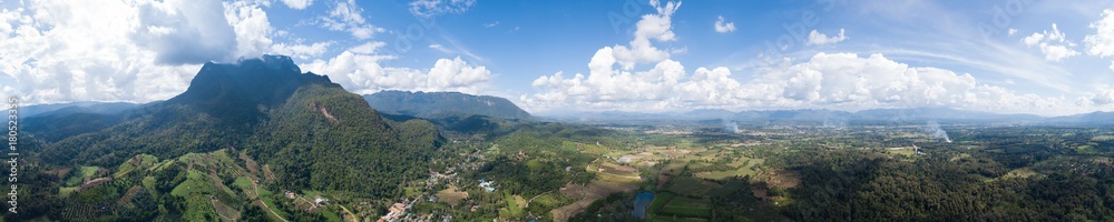 Aerial top view photo from flying drone of the Buddhist temple and fields in  the countryside of Chiang Mai, Northern Thailand