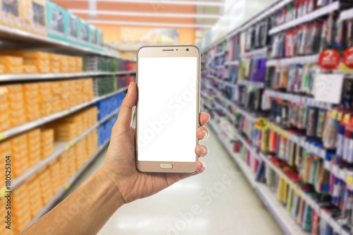woman hand using smart phone on Supermarket blur background