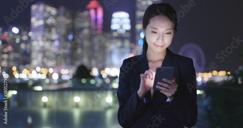 Wallpaper Mural Business woman use of mobile phone in Hong Kong city Torontodigital.ca