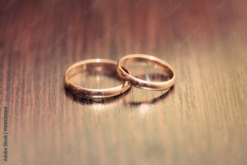 Two rings on a wooden surface Two rings on a wooden surface