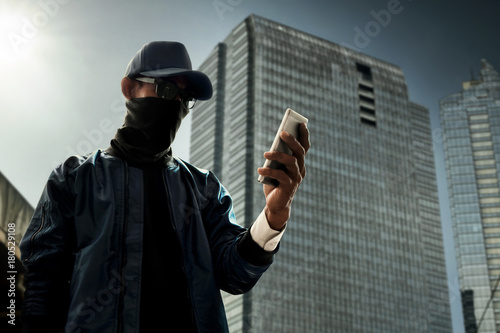 Hacker using mobile phone