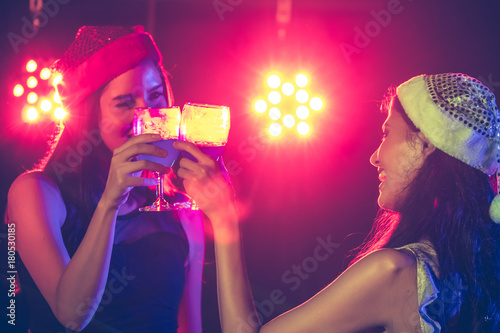 new year party, holidays, celebration, nightlife and people concept - Beautiful girls having fun at a party.