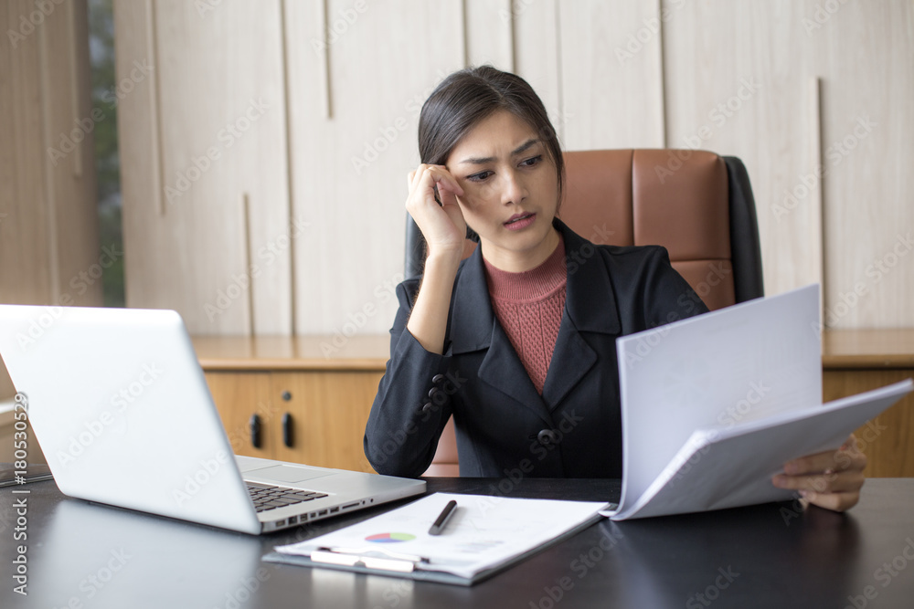 Asian woman working hard with serious emotion at office, woman working hard concept. Asian woman working hard with serious emotion at office, woman working hard concept.