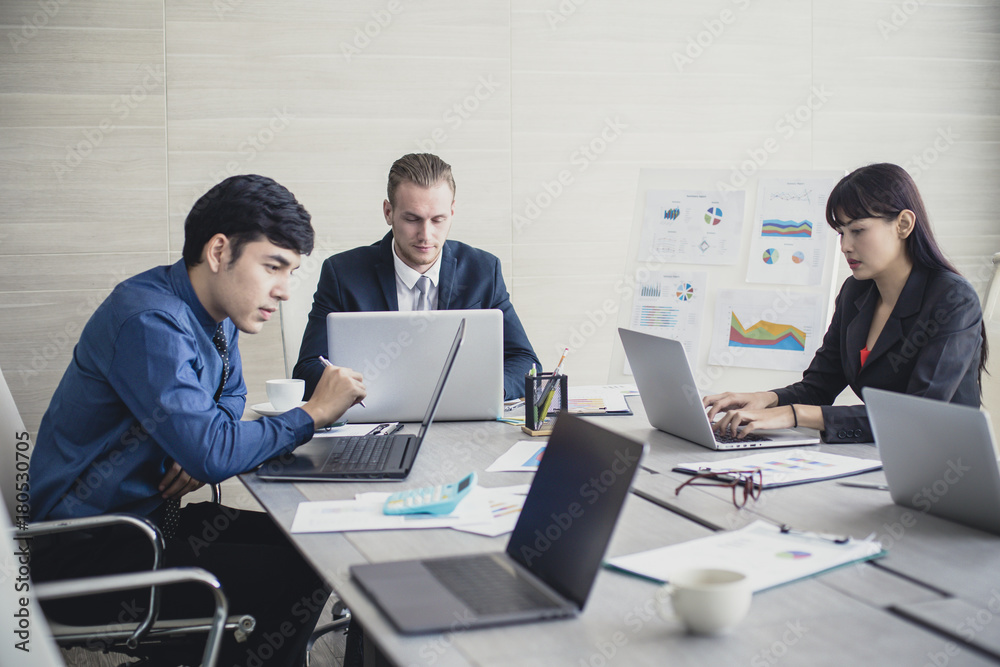 Young Business people working together with serious emotion. Business people takling in modern office. business people working concept Vintage tone. Young Business people working together with serious emotion. Business people takling in modern office. business people working concept Vintage tone.