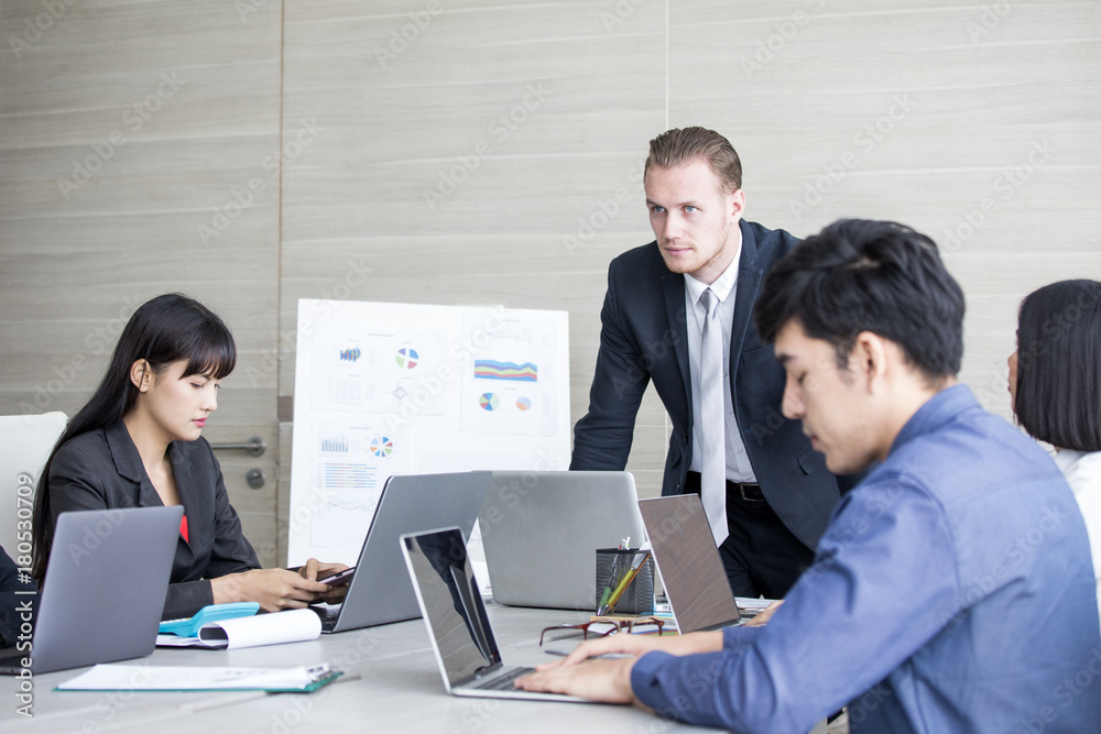 Young Business people working together with serious emotion. Business people takling in modern office. business people working concept Young Business people working together with serious emotion. Business people takling in modern office. business people working concept