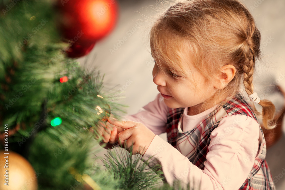 Pretty little child near Christmas tree. Pretty little child near Christmas tree.