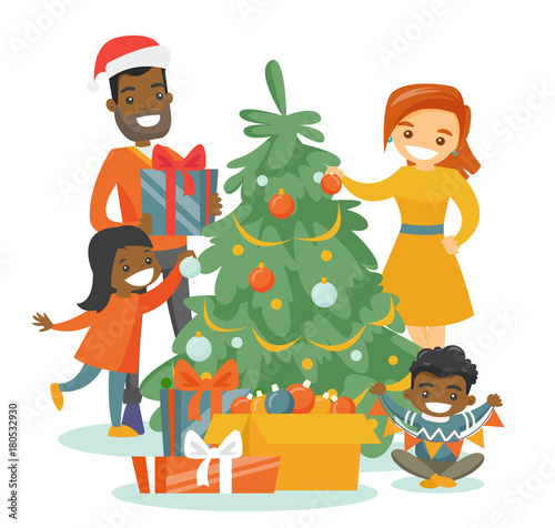 Young happy multiethnic family decorating the Christmas tree