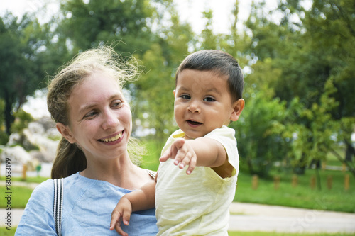 Happy biracial family - mother and little son.