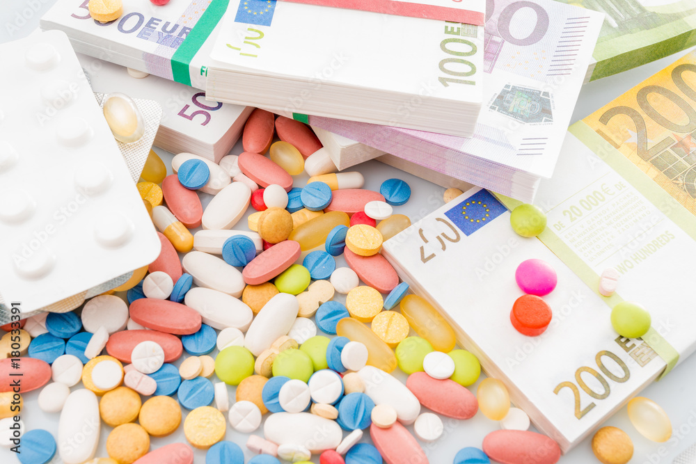 Money and pills. Pills of different colors on money. medicine concept. Euro cash Money and pills. Pills of different colors on money. medicine concept. Euro cash