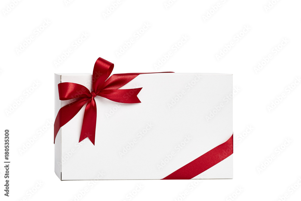 The white box wrapped with red ribbon with a bow The white box wrapped with red ribbon with a bow