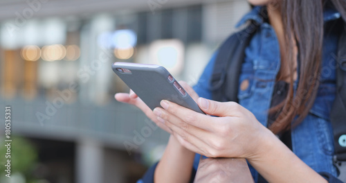 Woman using mobile phone at outdoor