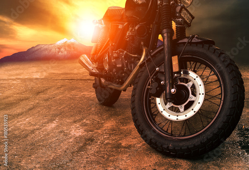 old retro motorcycle and beautiful sunset sky background © stockphoto mania