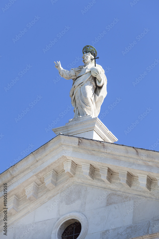 16th-century Benedictine San Giorgio Maggiore church, statue on the top, Venice, Italy.