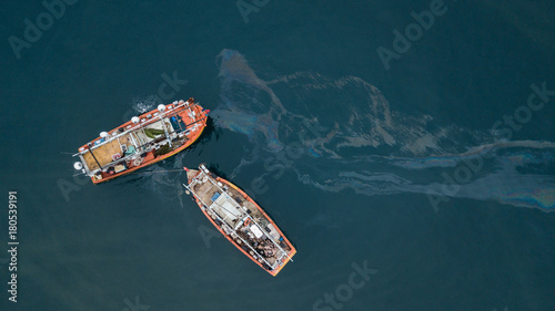 Fishing boats and oil spill