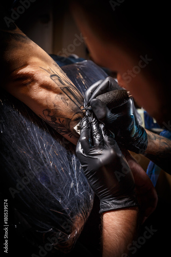 Close up tattoo artist © Grafvision