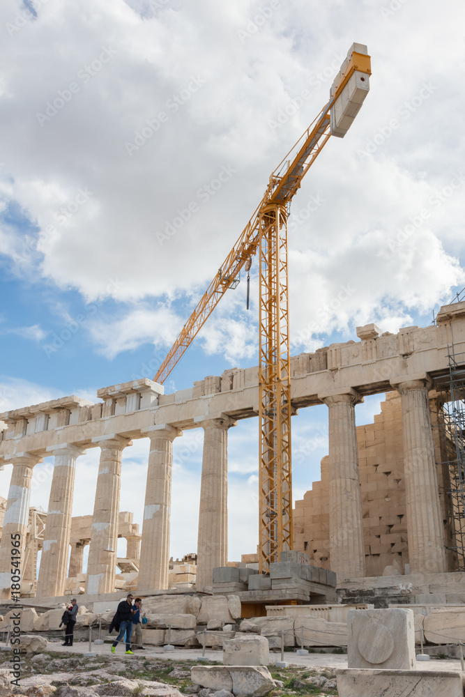 Acropolis, Athens, Greece - October 24, 2017: Many tourists from different nations visit the Parthenon temple on the Acropolis hill. Acropolis, Athens, Greece - October 24, 2017: Many tourists from different nations visit the Parthenon temple on the Acropolis hill.