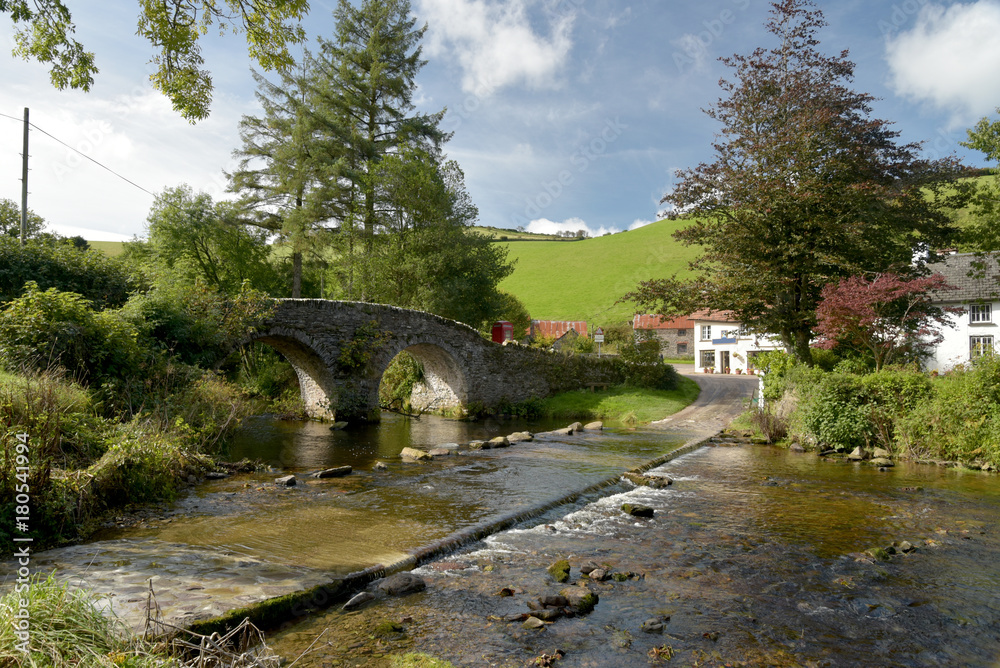 Fototapeta premium Packhorse bridge and ford at Malmsmead, Exmoor, North Devon
