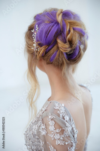 A gentle portrait of a bride girl with an air crochet with purple hair strands from the back.