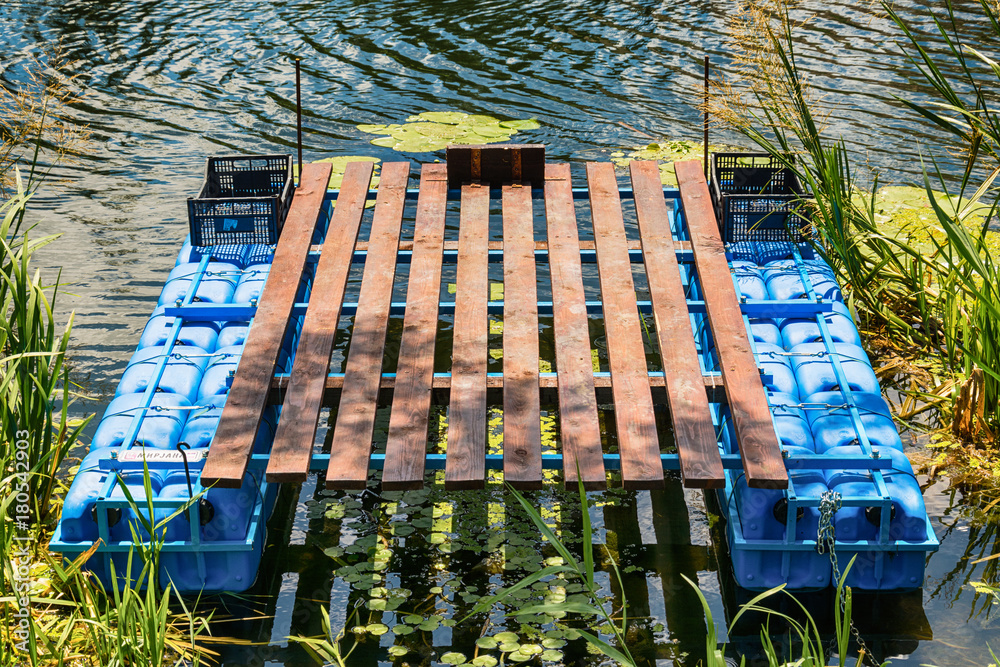 Naklejka premium small raft on the river
