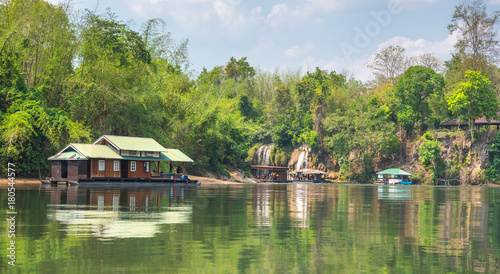 Tourism on the floating house rafting at the river Kwai, Kanchanaburi, Thailand.