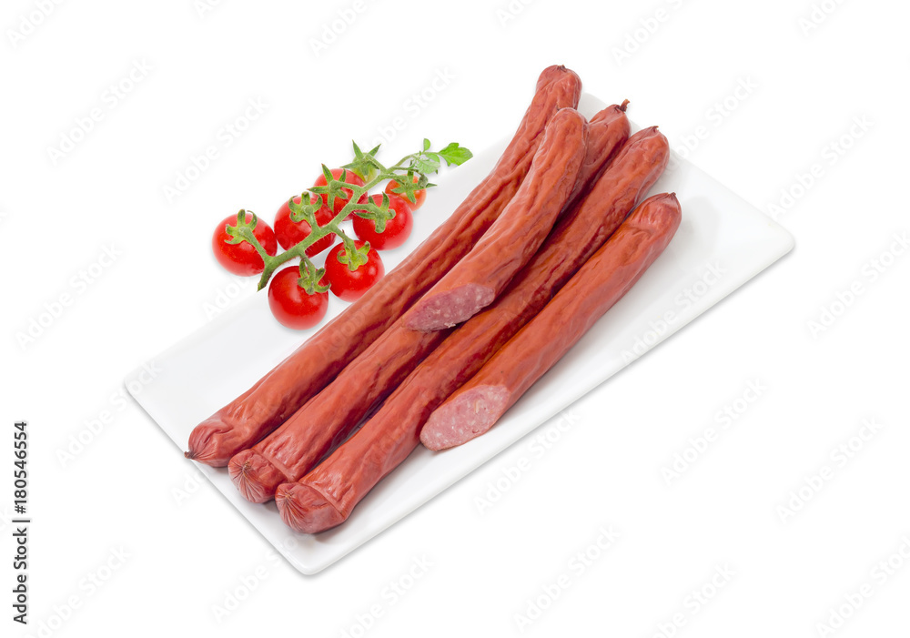 Smoked vienna sausages on dish and cherry tomato branch Smoked vienna sausages on dish and cherry tomato branch