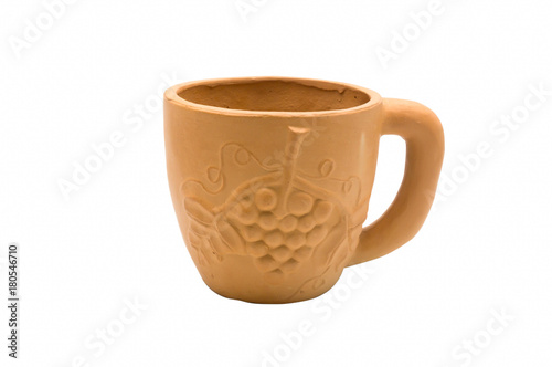 Earthenware cup with grape fruit pattern on the side.