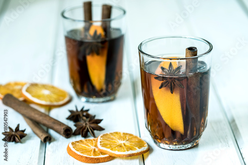 The Mulled wine on white table in night celebration of New Year party and delicious Christmas drink for autumn and winter season