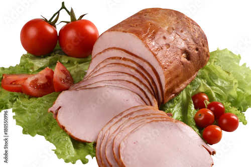Sliced smoked meat with tomatoes and greens. Pork.