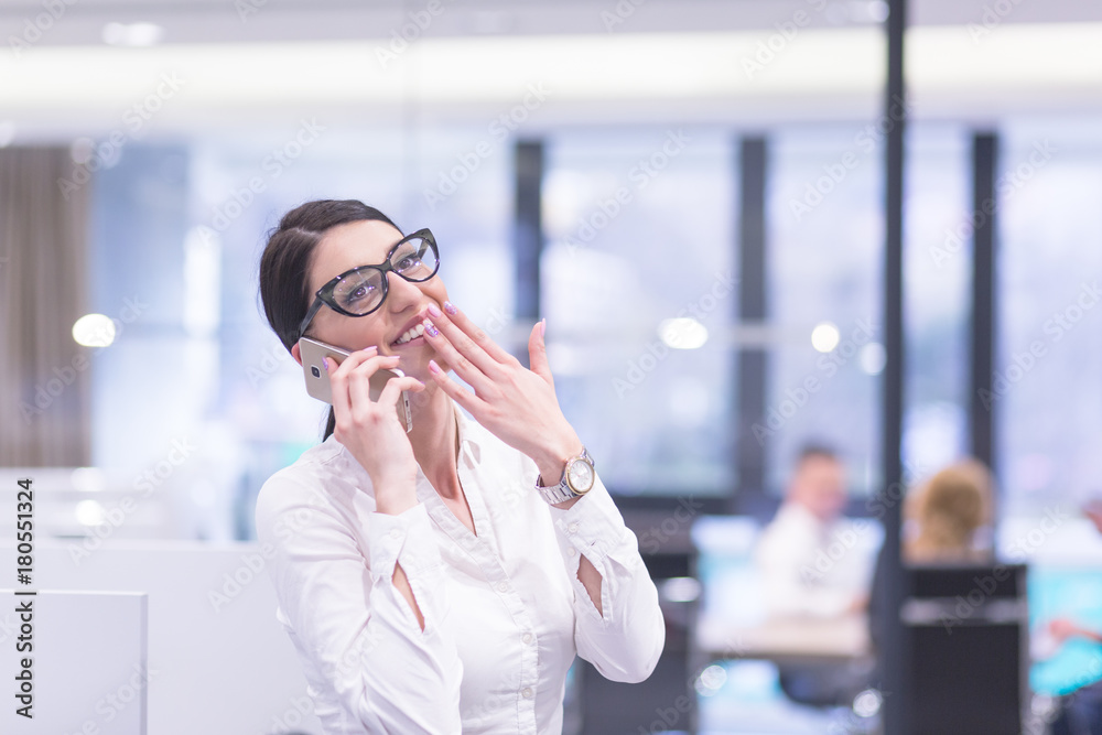 Elegant Woman Using Mobile Phone in startup office building Elegant Woman Using Mobile Phone in startup office building