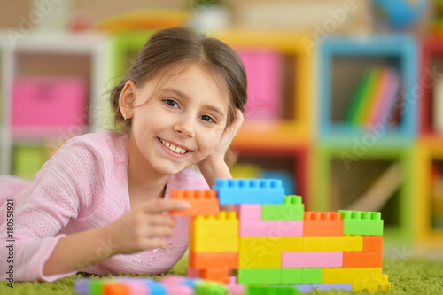 little girl with colorful plastic blocks