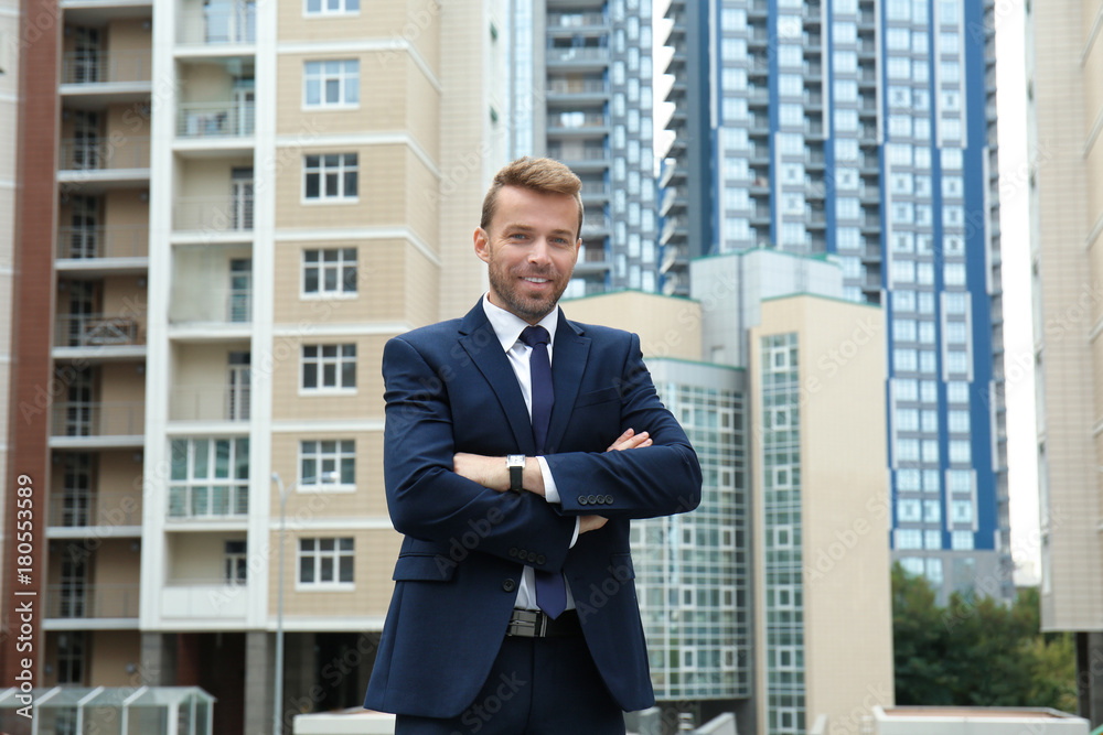 Attractive man in formal suit on city street Attractive man in formal suit on city street