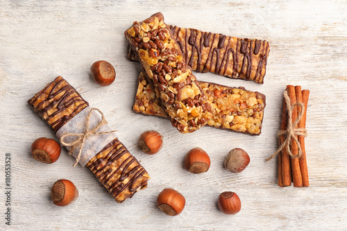 Composition with healthy cereal bars on wooden background