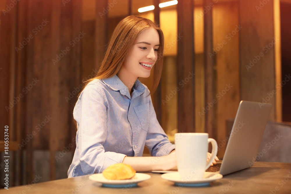 Young female marketing manager working in cafe Young female marketing manager working in cafe