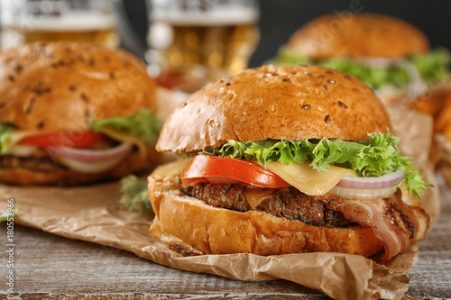 Tasty beef burger on table