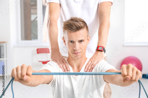 Physiotherapist working wit...
