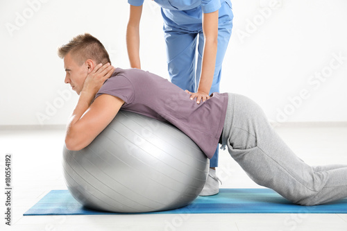 Physiotherapist working wit...