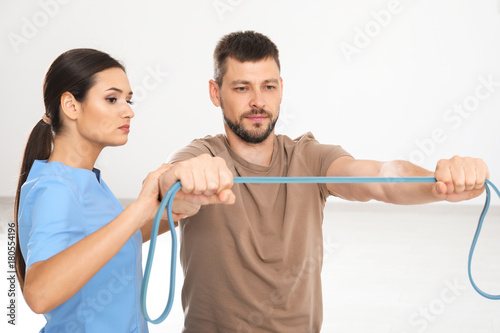 Physiotherapist working wit...