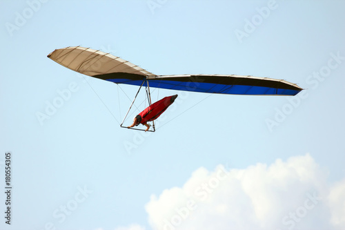 man flying on a hang glider.