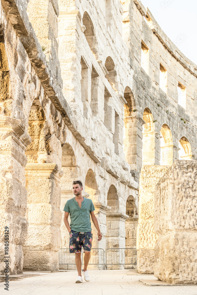 Fototapeta premium young man at the Pula Arena Croatia