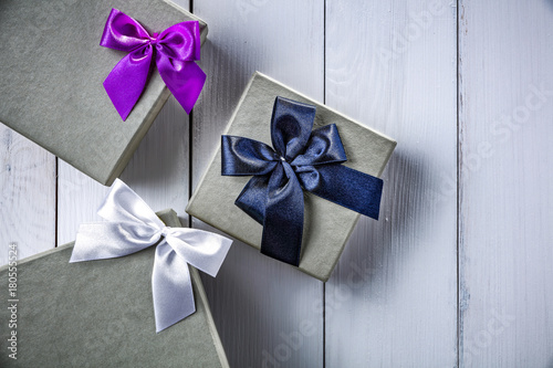 Christmas gifts on white wooden table and pfoto from above.  photo