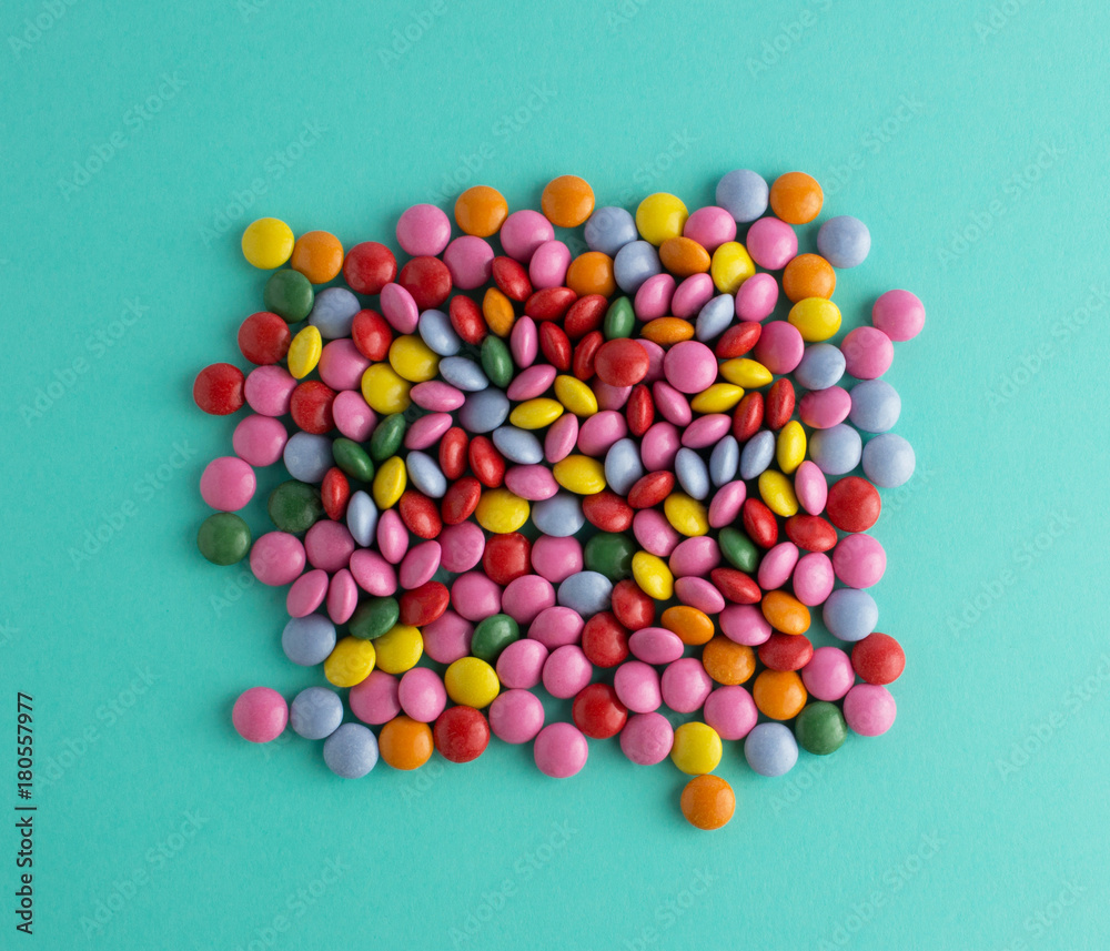 colorful chocolate candy group on blue mint background  top view
