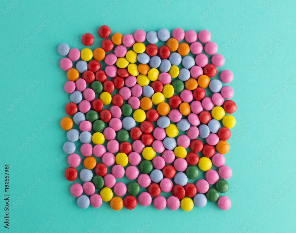 colorful chocolate candy group on blue mint background colorful chocolate candy group on blue mint background