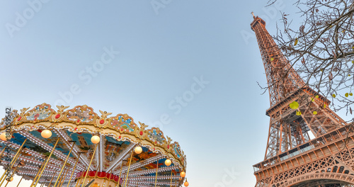 The Eiffel Tower and Merry-Go-Round wheel at sunset, Paris - France © jovannig